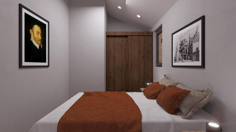 Slaapkamer in Beach House Zuid, EuroParcs Enkhuizer Strand, met tweepersoonsbed, kunstwerk en kast.