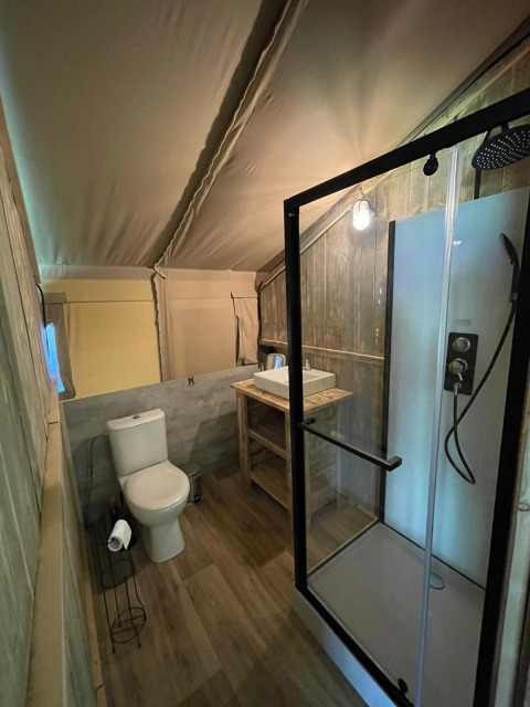 Modern bathroom in a safari tent with sanitary facilities at Camping Bockenauer Schweiz, Germany.