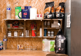 Well-stocked pantry with food and essentials at Feather Down Les Jardins des Coccinelles in Brittany, France.
