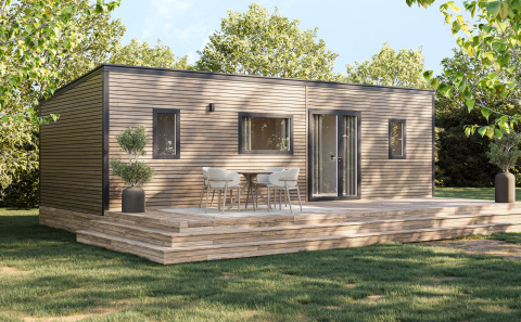 Lodge Prestige Cottage en Camping Seasonova Les Marguerites, Francia, con terraza de madera y sillas