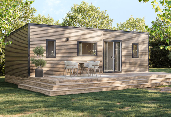 Lodge Prestige Cottage en Camping Seasonova Les Marguerites, Francia, con terraza de madera y sillas