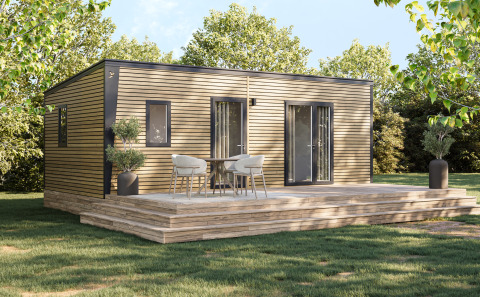 Cabaña de madera moderna con terraza y muebles de exterior rodeada de árboles en Camping Seasonova Les Marguerites.