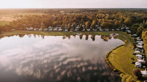 Aerial view of the lake and caravans at Recreatiepark De Achterste Hoef holiday park in North-Brabant, Netherlands.