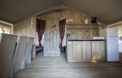Interior view of a Safari Tent Luxury kitchen and dining space at Camping Valkanela in Croatia.