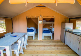 Interior of Safari tent Comfort with air conditioning at Camping Porto Sole, Croatia. Cozy, modern setup.