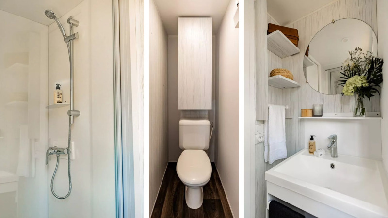 Baño moderno en una tienda tipo cabaña safari con ducha, inodoro y lavabo en Papillon Country Resort.