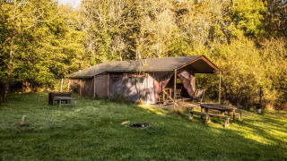 Safari tent called Tent cottage with private hot shower at Feather Down Upper Shadymoor Farm, UK.
