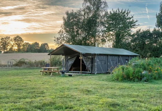 Safari tent named Tent house with private hot shower next to it at Feather Down La Ferme de Fontenille, Spain.