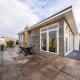 Modern lodge with patio and large glass doors at Resort Mooi Bemelen, Netherlands, Biebosch - Sunshower.