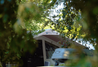 Tent partially hidden by trees at Camping Valkanela, a holiday park in Istria, Croatia.