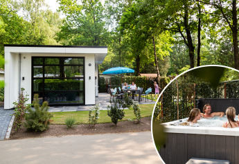 Modern tiny house called Special Wellness Module (Spa) with patio, garden, and guests enjoying outdoor hot tub.