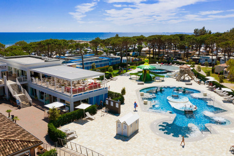 Camping Village Cavallino holiday park in Veneto, Italy with pool, restaurant, and sea view.