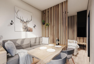 Modern lodge at Edelweiss, Ossiacher See, Austria featuring a cozy dining area and stylish decor.