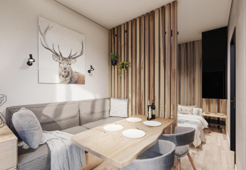 Moderne lodge ved Edelweiss, Ossiacher See, Østrig med hyggelig spisestue og stilfuld indretning.