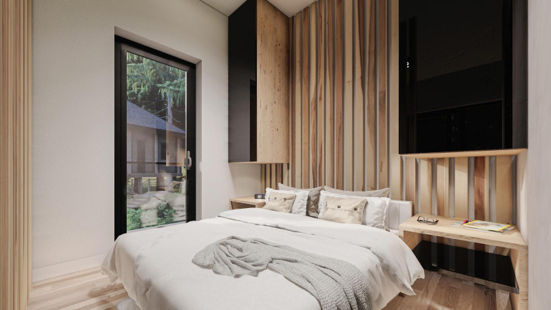 Dormitorio moderno con paneles de madera y gran ventana, lodge Edelweiss en Ossiacher See, Austria.