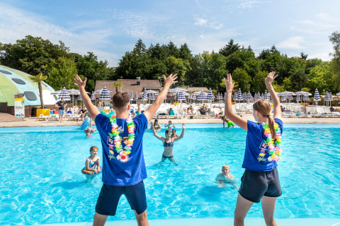 Two instructors lead water aerobics in the pool at hu Birkelt Village holiday park in Mersch, Luxembourg.