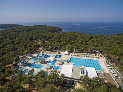 Aerial view of Camping Cikat holiday park showing pools and water slides in Primorje-Gorski Kotar, Croatia.