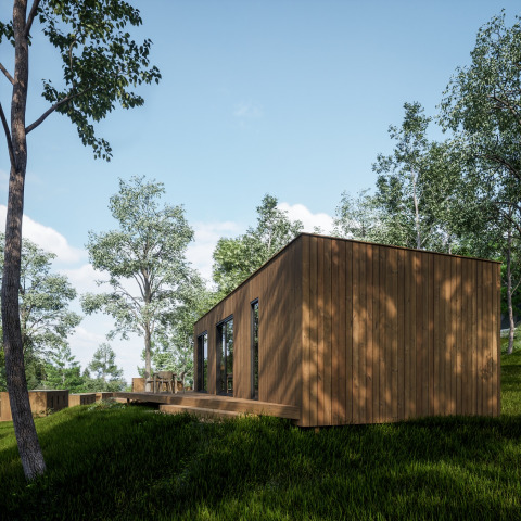Wooden cabin at Hameau de l'Ourthe holiday park in Belgium Luxembourg, surrounded by trees and nature.
