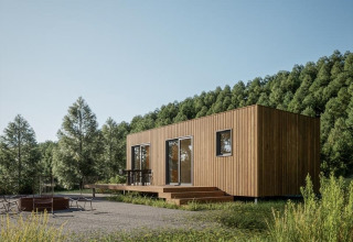 Cabaña moderna de madera en Hameau de l'Ourthe, rodeada de colinas verdes y bosques en Bélgica.