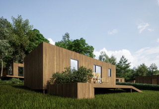 Moderne træhytte med terrasse i grønt område ved Hameau de l'Ourthe feriepark i Belgien Luxembourg.