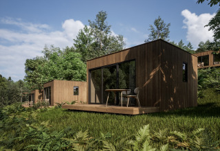 Modern wooden cabins surrounded by nature at Hameau de l'Ourthe holiday park, Belgium Luxembourg, Belgium.