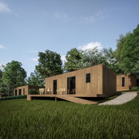 Moderne houten vakantiewoningen met terras in het Hameau de l'Ourthe, België, omringd door groen.