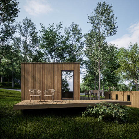 Moderne houten cabin met terras en stoelen tussen bomen bij Hameau de l'Ourthe vakantiepark, België.