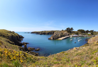 Panoramic view of the coastline near Saint Jean de Monts, Pays de la Loire, France, with boats and cliffs.