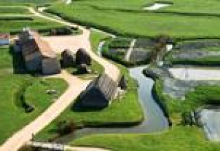 Aerial view of Flower Camping La Davière Plage holiday park in Pays de la Loire, France, with green fields.