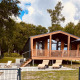 Modern Lakehouse Scandi at Wilsumer Berge, Germany, with sun loungers and terrace surrounded by nature.