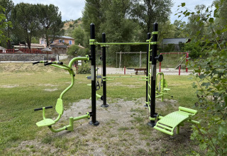 Outdoor fitness equipment on grass at Flower Camping La Rivière holiday park, Provence-Alpes-Côte d’Azur, France.