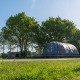 Modern Riverdome tiny house with bathroom and hot tub in green surroundings at Holiday Park Mölke, Netherlands