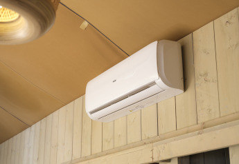 Indoor view of an air conditioner on the wall of Safari tent Ranger, Rhederlaagse Meren, Netherlands.