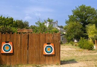 Archery range with wooden targets at Flower Camping L'Ile d'Offard, holiday park in Pays de la Loire, France.