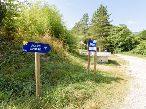 Signs at Flower Camping Mas de Champel, a holiday park in Auvergne-Rhône-Alpes, France.