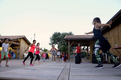 Outdoor dance class for children and adults at Flower Camping Le Bel Air in Nouvelle-Aquitaine, France