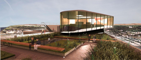 Modern glass building on a rooftop terrace with green landscaping at Flower Camping La Chênaie in Normandy, France.