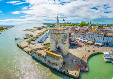 View of the harbor and historic tower near Le Bois-Plage-en-Ré in Nouvelle-Aquitaine, France.