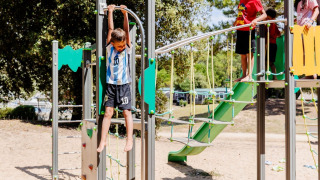 Children enjoy a modern playground at Camping Demoiselles Plage holiday park in Pays de la Loire, France.