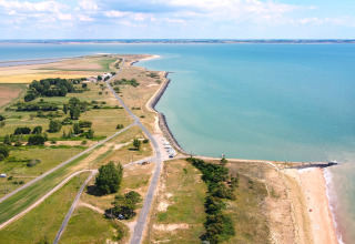 Aerial view of Flower Camping Les Dunes by the beach and fields in Pays de la Loire, France.