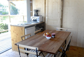 Interior of a safari tent, Hut Lodge Standaard, at Flower Camping Le Bois d'Amour in France.