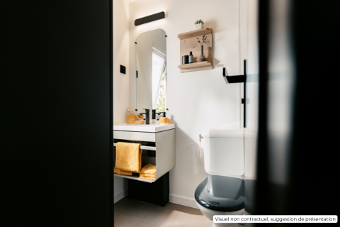 Modern bathroom with white walls, black toilet, sink, and yellow towel at Homeflower Premium lodge in France.