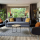 Salón moderno en Cozy Lodge, Bungalowpark Het Verscholen Dorp, Países Bajos, con sofá y sillones amplios.