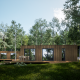 Moderne træhytte fra Eco Lodge ved Hameau de l'Ourthe i Belgien, omringet af grønne træer og natur.
