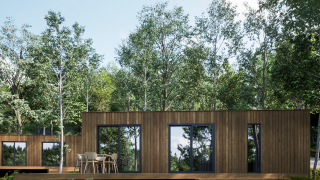 Lodge en bois moderne à l'Eco Lodge du Hameau de l'Ourthe en Belgique, entouré d'arbres et de verdure.