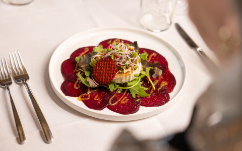 A beautifully plated appetizer at Wellness Lodge XL, Hof van Salland, the Netherlands, on a white tablecloth.
