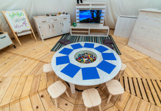 Bright children’s play area at Camping Arena One 99 Glamping in Istria, Croatia, featuring LEGO bricks and wooden toys.