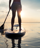 Supboarding bei Sonnenuntergang
