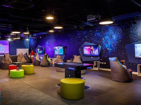 Gaming lounge with bean bags and large screens at Valamar Camping Istra holiday park in Istria, Croatia.