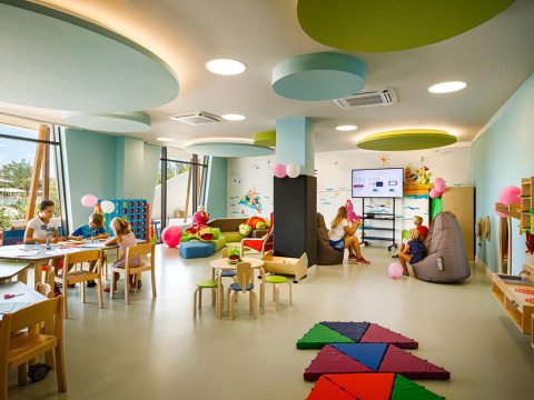 Children playing and doing activities in a bright playroom at Valamar Camping Istra holiday park in Istria, Croatia.